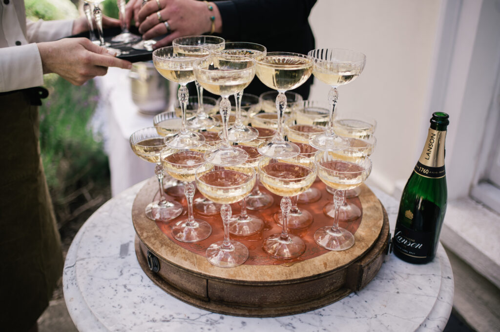 Half a champagne tower with two levels left filled